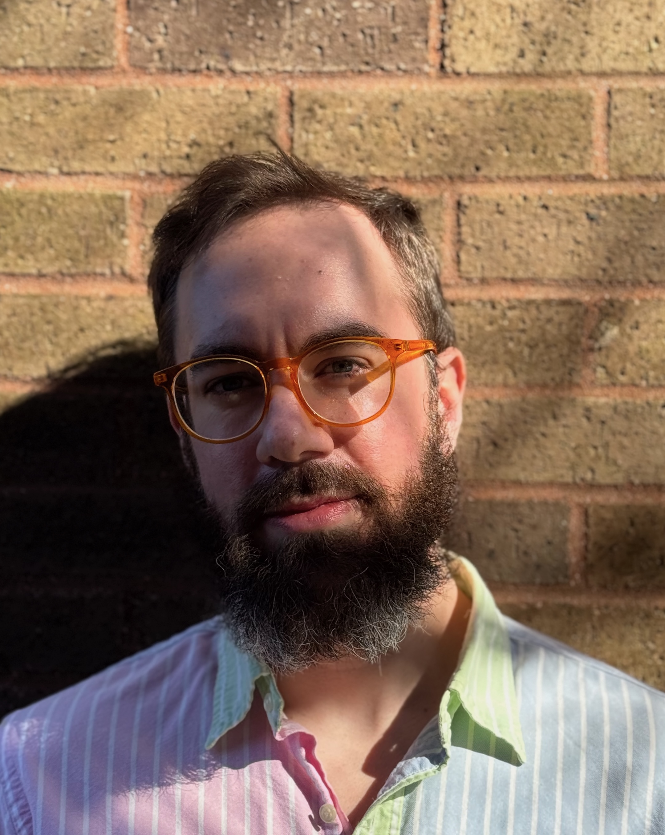 Professional headshot of Justin Dollman